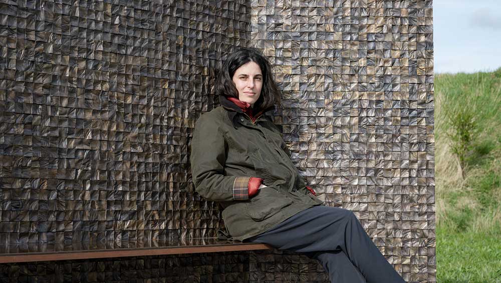 Selva Aparicio with her bronze sculpture At Rest, Nieuwpoort, Belgium, 2024. Courtesy The Artist.