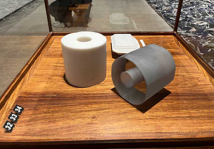 Ai Weiwei, Marble Toilet Paper, 2020, Marble Takeout Box, 2015, and Glass Toilet Paper, 2022. Installation view, Ai Weiwei: Making Sense, The Design Museum, London 2023. Photo: Veronica Simpson.
