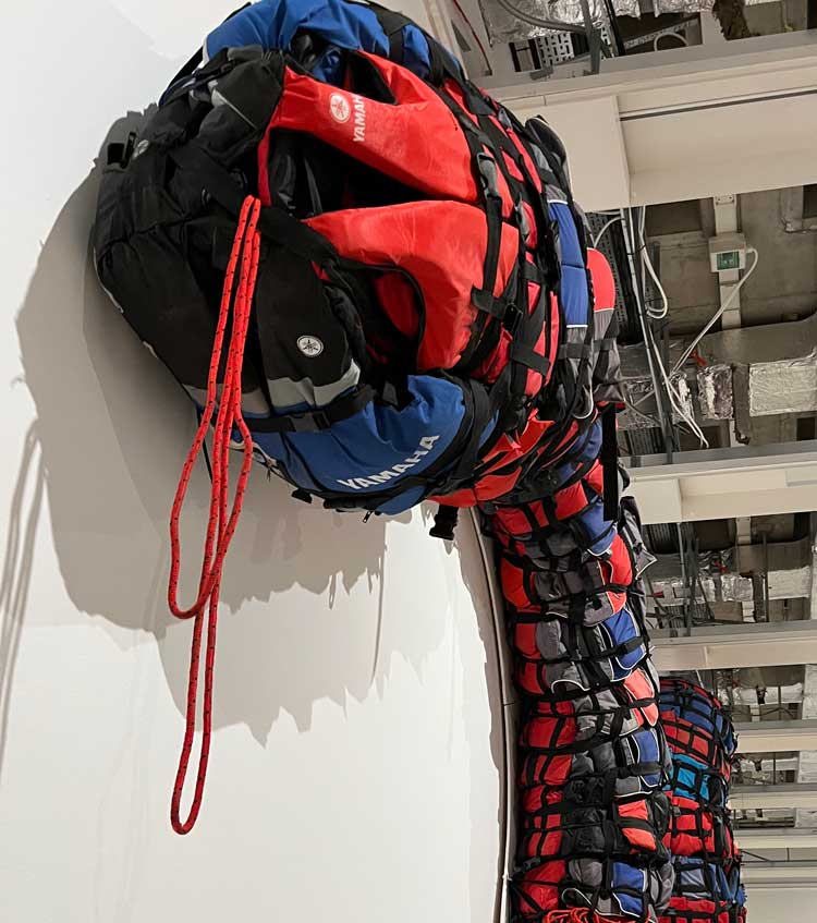 Ai Weiwei, Life Vest Snake, 2019. Installation view, Ai Weiwei: Making Sense, The Design Museum, London 2023. Photo: Veronica Simpson.