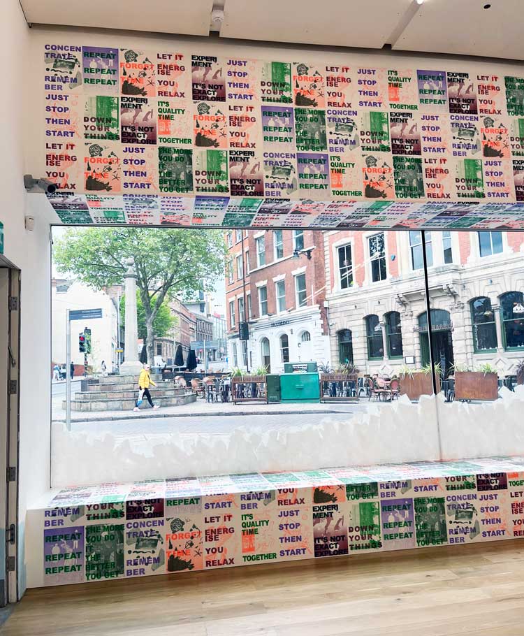 Instructional posters across the window. Assemble and Schools of Tomorrow: The Place We Imagine, installation view at Nottingham Contemporary, 2022.Photo: Veronica Simpson.