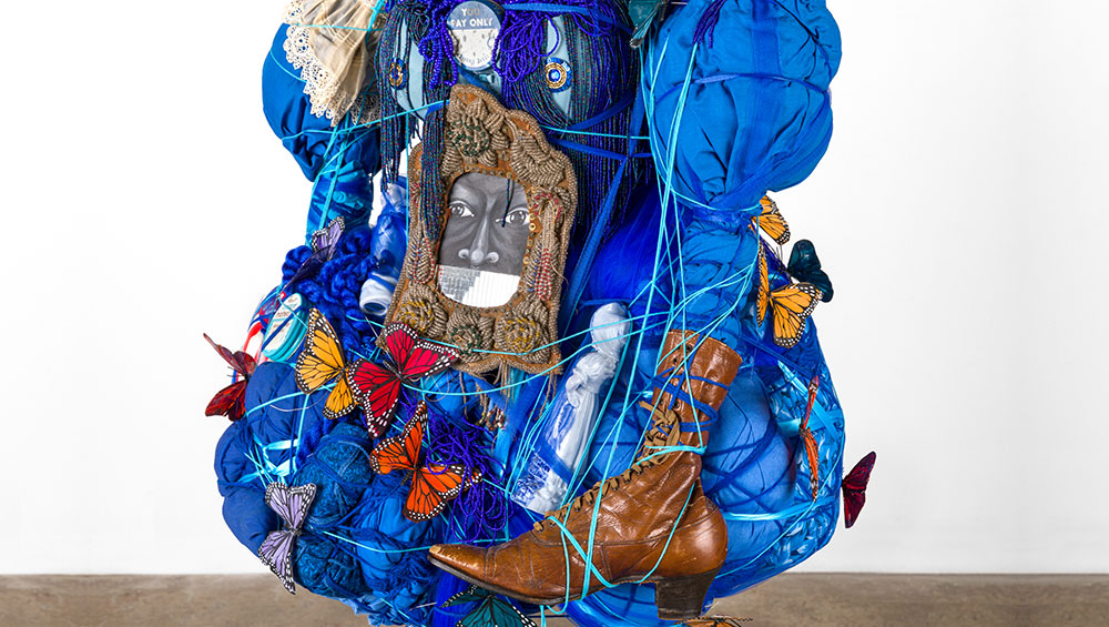 Benny Andrews, Circle, 1973. Oil on 12 linen canvases with painted fabric and mixed media collage, 120 x 288 in. Installation view, The Armory Show 2021. Photo: Jill Spalding.