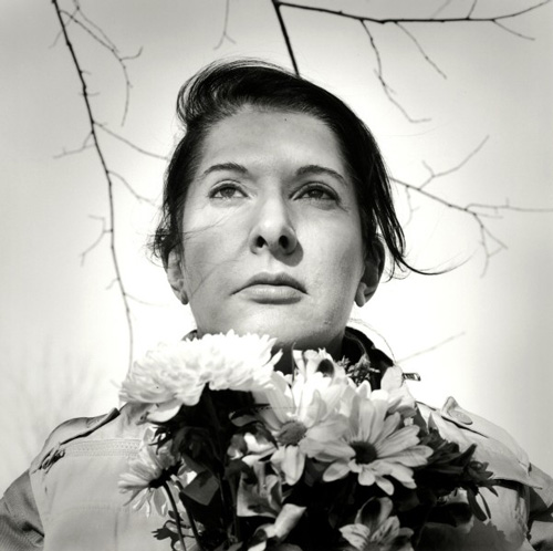 Marina Abramović. Portrait with Flowers, 2009. Black-and-white gelatin silver print; photo: Marco Anelli.