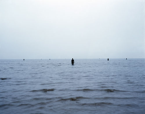Antony Gormley. Another Place, 1997. Cast iron, 189 x 53 x 29 cm (100 elements). Installation view, Cuxhaven, Germany. © Antony Gormley. Photograph by Helmut Kunde.