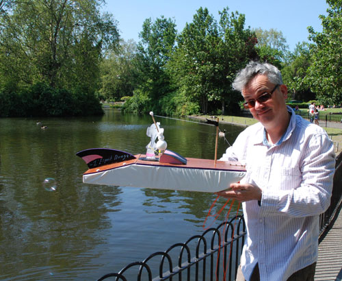 Kit Poulson with boat made by Kit Poulson, Edwina Ashton and Mirabel Ashton-Poulson, 2012.