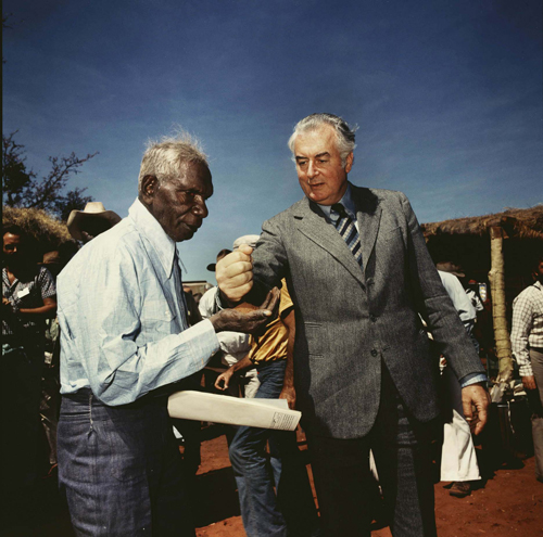 Mervyn Bishop. Prime Minister Gough Witlam pours soil into the hands of traditional land owner Vincent Lingiari, Northern Territory 1975, 1999. Type R3 photograph, 30.5 x 30.5 cm.