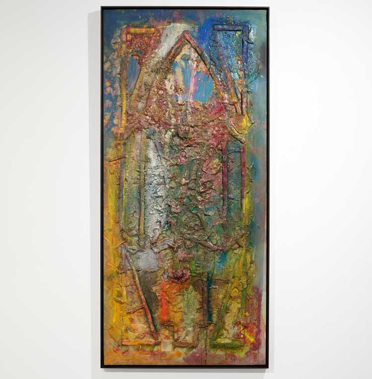 Frank Bowling. Ancestor Window, 1987. Acrylic paint, acrylic gel and found additions on canvas, 188.4 x 86.1 cm. Installation view: Frank Bowling and Sculpture, The Stephen Lawrence Gallery, University of Greenwich, London, 15 July – 3 September 2022. © Frank Bowling. All rights reserved DACS 2022. Courtesy the artist. Photo: Peter Mallet.