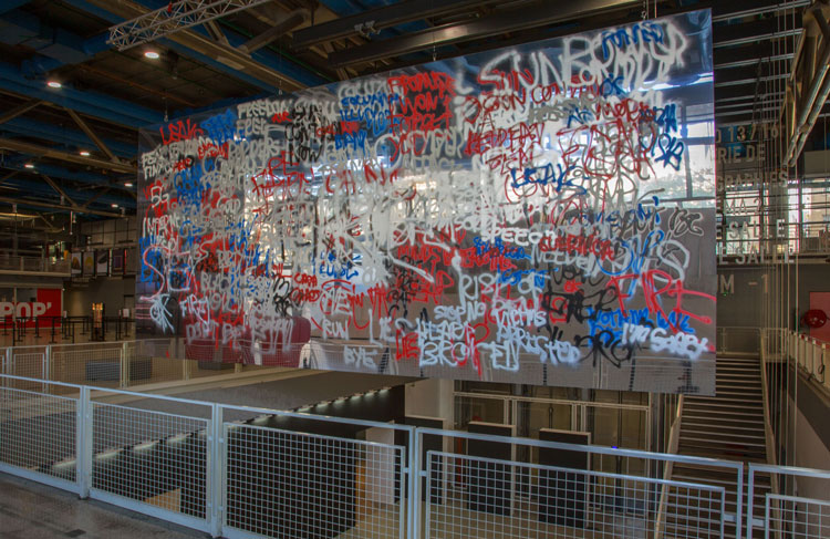 Stefan Brüggemann. Headlines and Last Lines in the Movies (Guernica), 2019. Alupanel, aluminium, spraypaint, 349 x 777 cm (137 3/8 x 305 7/8 in). Installation view, Extra! Festival, Centre Pompidou, Paris. © Stefan Brüggemann. Courtesy the artist and Hauser & Wirth.
