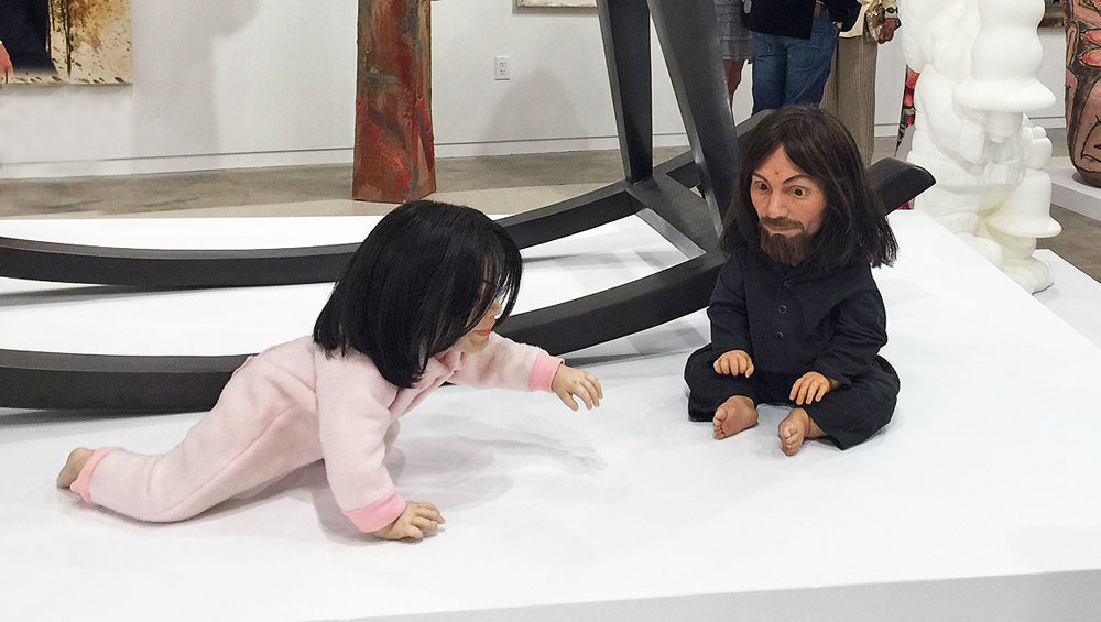 John Waters, Playdate, 2006 (foreground). Silicone sculpture of Michael Jackson and Charles Manson. Installation view, The Bunker Artspace, West Palm Beach, Florida. Photo: Jill Spalding.
