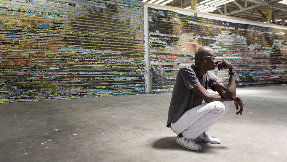 Mark Bradford at the Hirshhorn Museum and Sculpture Garden with details of Pickett’s Charge, 2017. Courtesy of the artist and Hauser & Wirth. Photograph: Cathy Carver.