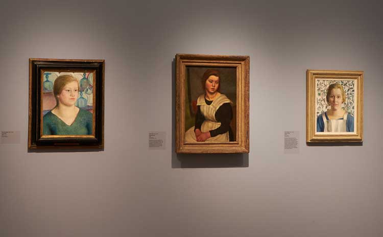 Centre: Mark Gertler, The Servant Girl, 1923. Installation view, Dora Carrington: Beyond Bloomsbury, 9 November 2024–27 April 2025, Pallant House Gallery, Chichester. Image courtesy Pallant House Gallery. Photo: Barney Hindle.