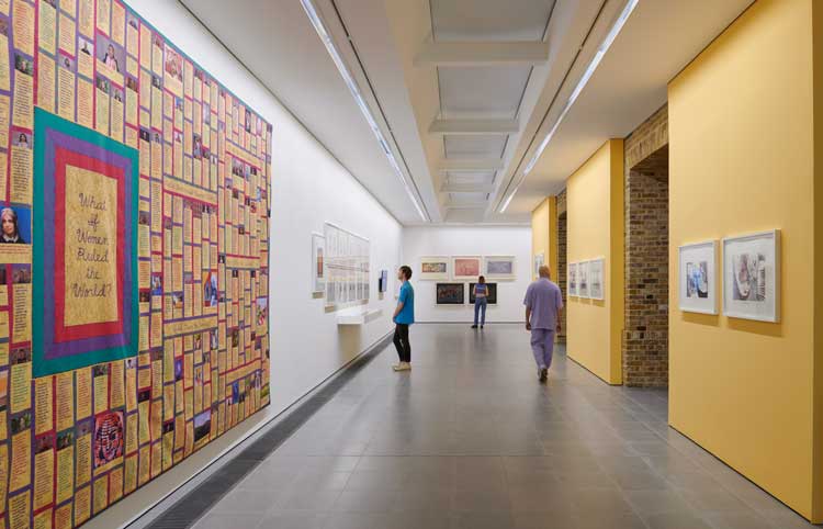 Left hand wall shows monumental quilt What If Women Ruled The World, 2022. Installation view, Judy Chicago: Revelations, 2024, Serpentine North. © Judy Chicago/Artists Rights Society (ARS), New York. Photo: Jo Underhill. Courtesy Judy Chicago and Serpentine.