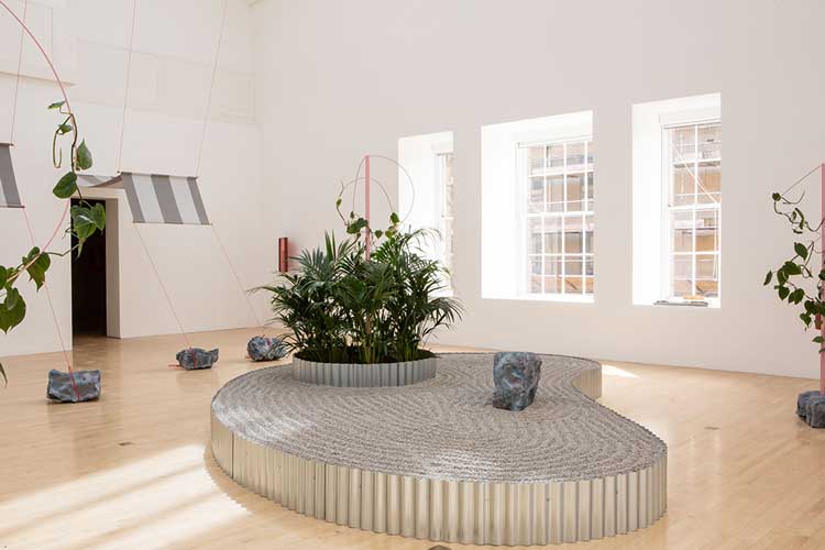 Céline Condorelli, Prologue, 2022, with Brise Soleil (2020), Props (2020–22), A Lot for a Little (2022), Alteration to Existing Conditions (windows). Installation view, Céline Condorelli: After Work, Talbot Rice Gallery, University of Edinburgh. Courtesy the artist and Talbot Rice Gallery. Photo: Sally Jubb.
