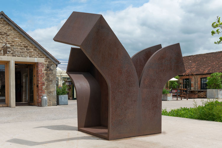 Eduardo Chillida, Consejo al Espacio IX (Advice to Space IX), 2000. Corten steel, 200 x 185 x 240 cm (78 ¾ x 72 7/8 x 94 ½ in). Installation view, Eduardo Chillida, Hauser & Wirth Somerset, 2021. Courtesy the Estate of Eduardo Chillida and Hauser & Wirth. Photo: Ken Adlard. © Zabalaga Leku. San Sebastián, VEGAP (2021).