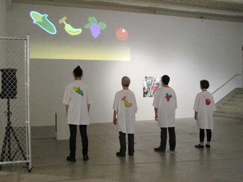 Xavier Cha. Fruit Machine 1, 2012. Four actors play four set roles, two passive and two hyperbolic determined by the chance roll of a slot machine-like app. The app spins every minute randomly resetting the performers for a duration of 32 minutes. Sound design by Jonathan Coward. App design by Samuel Cormier. ICA Philadelphia; Mount Tremper Arts.