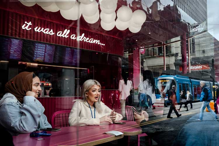 Merlin Daleman. A reflection of in the window of Archie’s Burgers in Birmingham, July 2022.