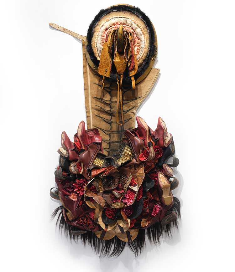 Anindita Dutta, Field of flowering bones, 2025, used shoes, used leather coat, human hair, purse, broken frame, artificial flowers, 79 × 39 × 13 in. Photo: Martin Seck