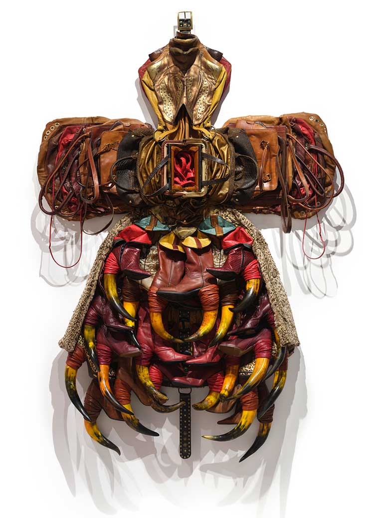Anindita Dutta, Hall of Opened Purses, 2024, leather belt, bag, boot, fur coat, dyed animal horns and dyed flowers, 79 × 58 × 8 1/2 in. Photo: Martin Seck