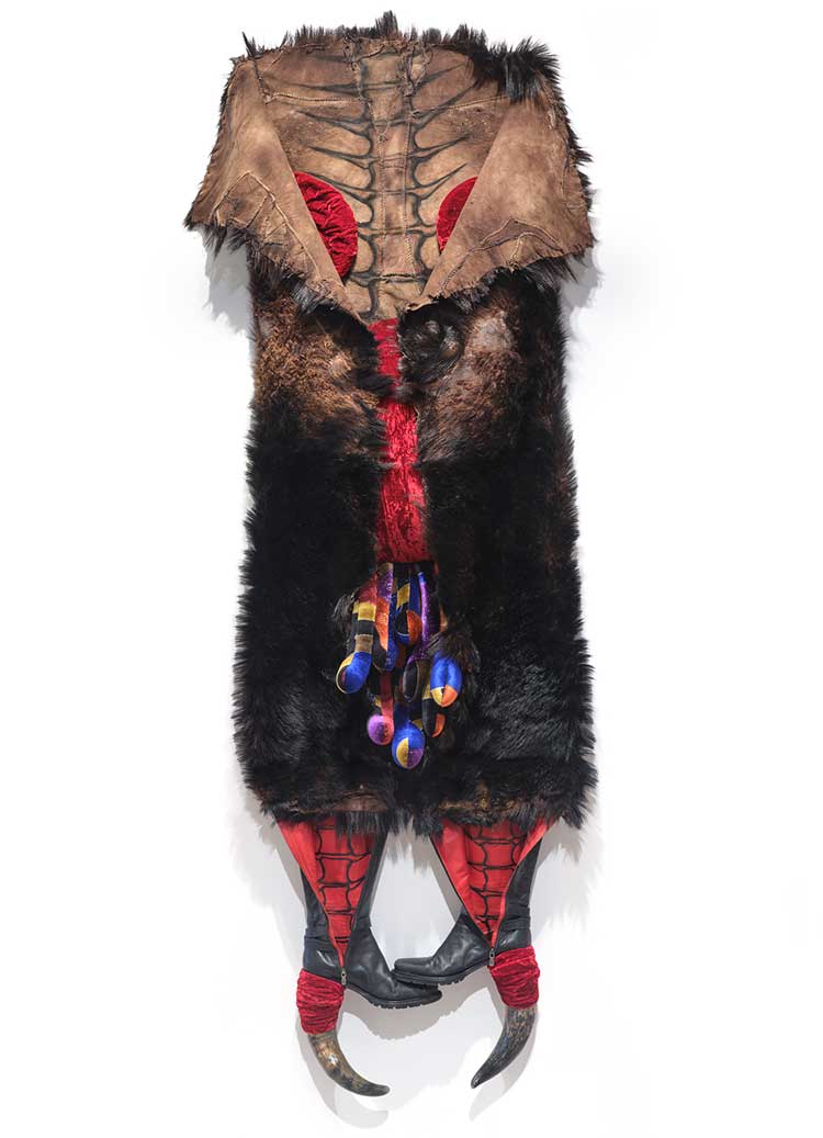 Anindita Dutta, Orchard within the hide, 2025, animal hide, horn, shoe, velvet cloth, 83 × 32 × 12 in. Photo: Martin Seck