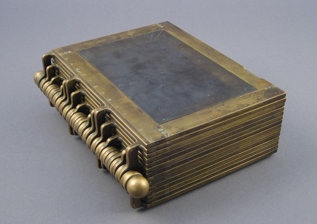Matt Donovan & Hallie Siegel. Self-Printing Book, 2004. Brass, 27.9 x 22.7 x 10.2 cm (11 x 9 x 4 in). Photograph: Matt Donovan & Hallie Siegel.