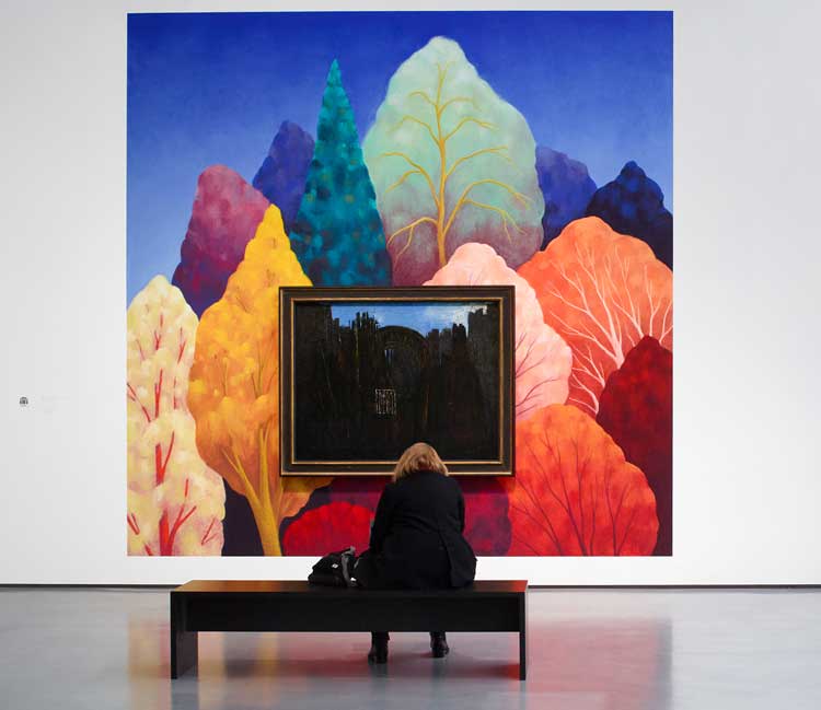 Pastel mural by Nicolas Party with Max Ernst’s Cage, Fôret et Soleil Noir (Cage, Forest and Black Sun, 1927). Installation view, Hepworth Wakefield, November 2024. Photo: Michael Pollard, courtesy The Hepworth Wakefield.