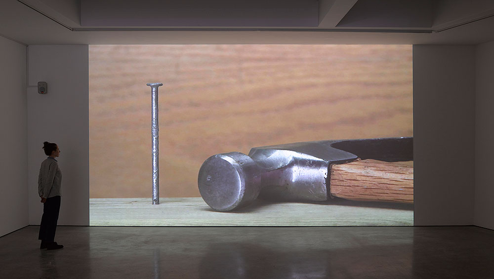 Ceal Floyer. Hammer and Nail, 2018. Video projection with audio,
dimensions variable. © Ceal Floyer. Courtesy Lisson Gallery.