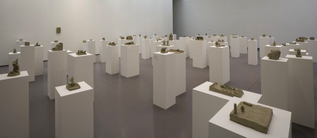 Peter Fischli David Weiss. Selections from Suddenly This Overview, 1981. Series of approx 600 sculptures in unfired clay, various dimensions, between 6 x 7 x 5 cm and 82 x 83 x 5 cm © Peter Fischli and David Weiss. Installation view: Peter Fischli & David Weiss: Flowers & Questions: A Retrospective, Kunsthaus Zürich, June 8–Sept. 9, 2007 Photograph: Courtesy Fischli Weiss Archive, Zürich.