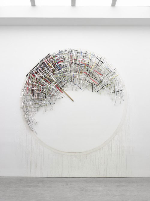 Mark Fox. In A Fool's House, 2013. Watercolour, ink acrylic, gouache, oil, colour pencil, graphite, marker, pen, crayon on paper, found broom, gallery dirt, 144 inch diameter. Courtesy of the artist.