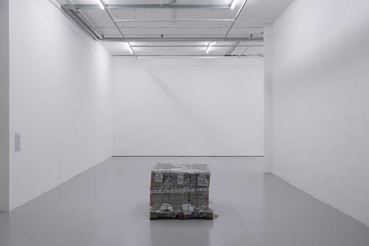 Sophia Al-Maria and Lydia Ourahmane. Birthright, 2024. Scottish sandstone, wood pallet, plastic wrapping, styrofoam, permanent marker. Installation view, Grey Unpleasant Land at Spike Island, Bristol, 2024. Photo: Rob Harris.