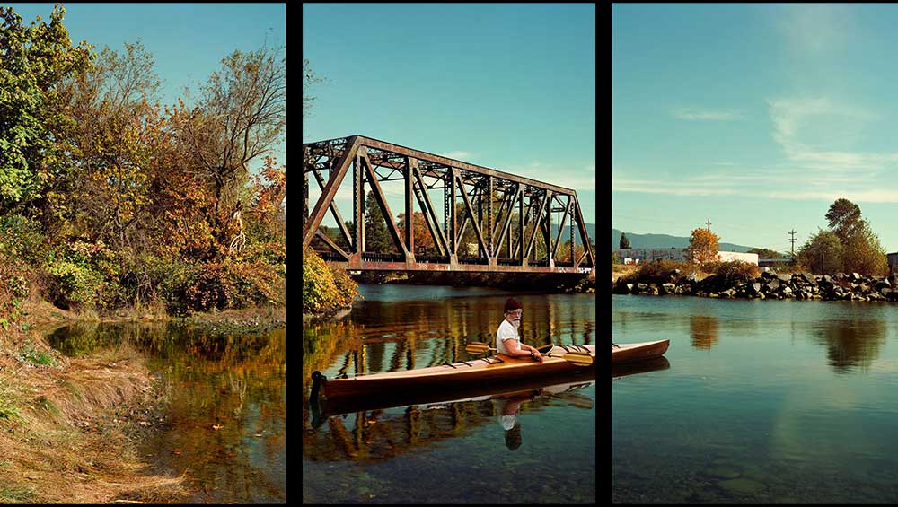 Rodney Graham, Paddler, Mouth of the Seymour, 2012-13. Painted aluminum lightboxes with transmounted chromogenic transparencies; triptych 304 x 554 x 18 cm (119 5/8 x 218 1/8 x 7 1/8 in), each panel 304 x 182 x 18 cm (119 5/8 x 71 5/8 x 7 in). © Rodney Graham. Courtesy the artist and Hauser & Wirth.