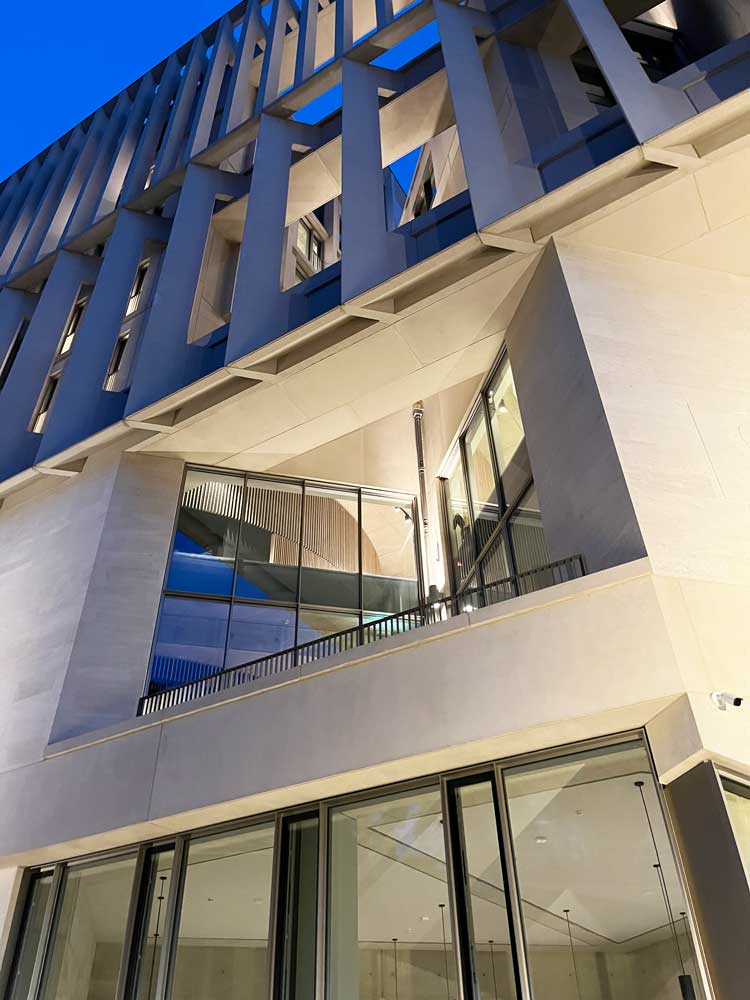 Night view shows how incisions into the Marshall Building's facade reinforce the sense of the structure as 'lantern' and allow light to percolate both in and out. Photo: Veronica Simpson.