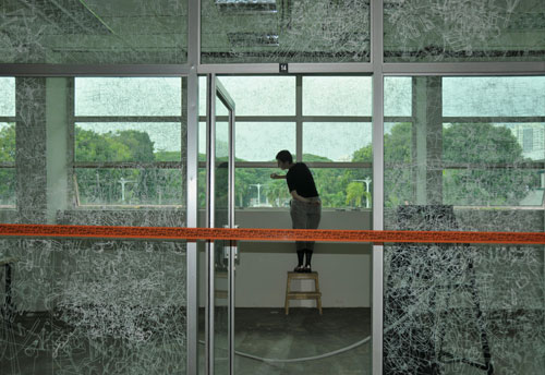Gosia Wlodarczak. Frost Drawing For Kallang, 2011. Performative drawing on glass
(in situ), at the Old Kallang Airport, Singapore.