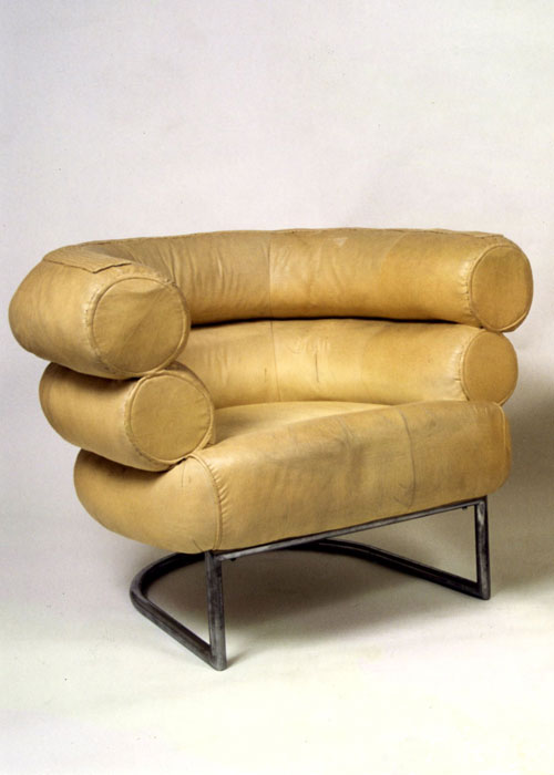 Eileen Gray. Bibendum armchair, circa 1930. Back and armrests made of two flared stacked rolls, stitched onto a deep semi-circular seat, canvas upholstery, originally ivory covered, chromed metal base. Photography: Christian Baraja, studio SLB and Provenance: Private collection, Paris.