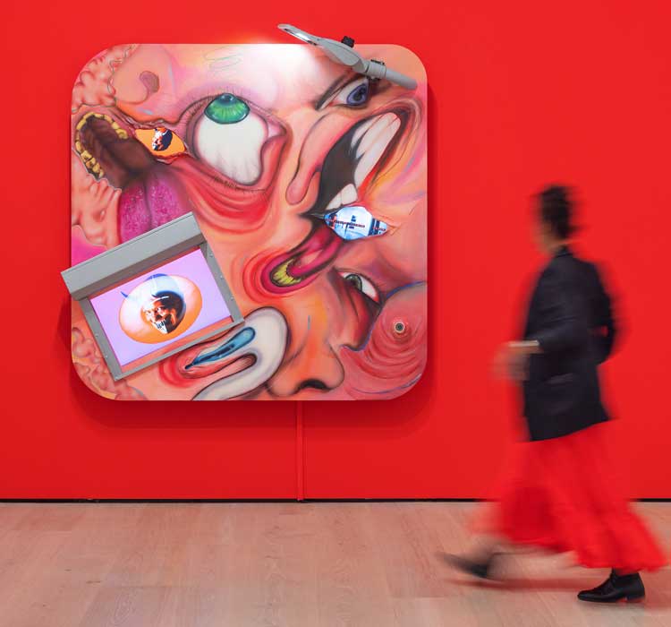 Gabriela Ruiz, Collective Scream, 2025. Acrylic, gouache, pastel, coloured pencil, acrylic pens, epoxy clay, metal hooks, metal pipes, metal hardware, LCD monitors, TV monitor, roll-up gate, LED streetlamp, and surveillance camera on wood panel. Courtesy of the artist. Made in L.A. 2025, installation view, Hammer Museum, Los Angeles, October 5, 2025–March 1, 2026. Photo: Sarah Golonka.