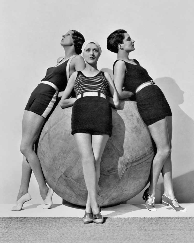 Erna Carise and models around a Michelin push-ball, 1930. © The George Hoyningen-Huene Estate Archives.
