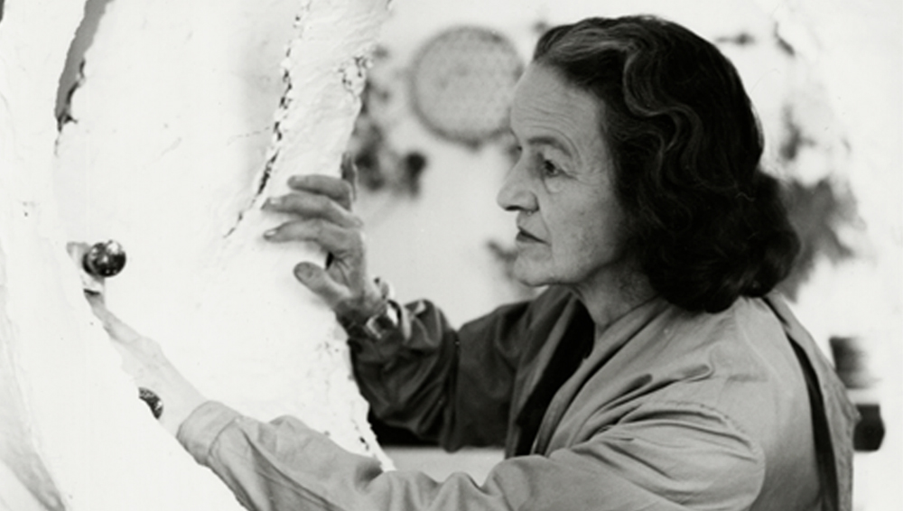 Barbara Hepworth at work on the plaster for Oval Form (Trezion), 1963. Courtesy Bowness. Photograph: Val Wilmer