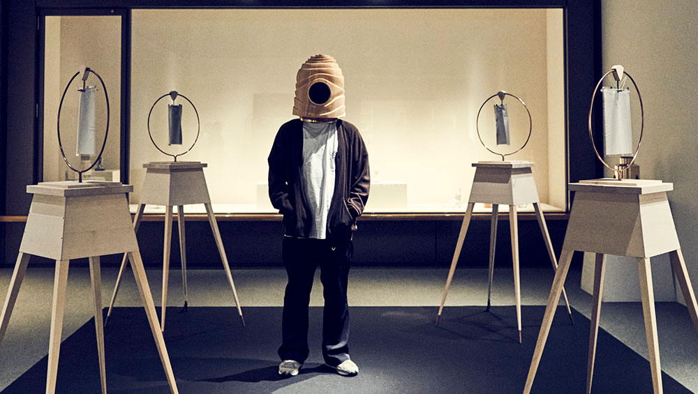 Stylist Shinichi Mita wearing a helmet for outer space by Nakagawa Mokkogei. Photo: Kenichi Muramatsu.