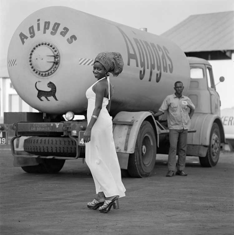 James Barnor. Model with Tank and Driver, 1974. Digital Fibre Print, 70 x 70 cm. Copyright James Barnor. Courtesy the Artist and October Gallery, London.