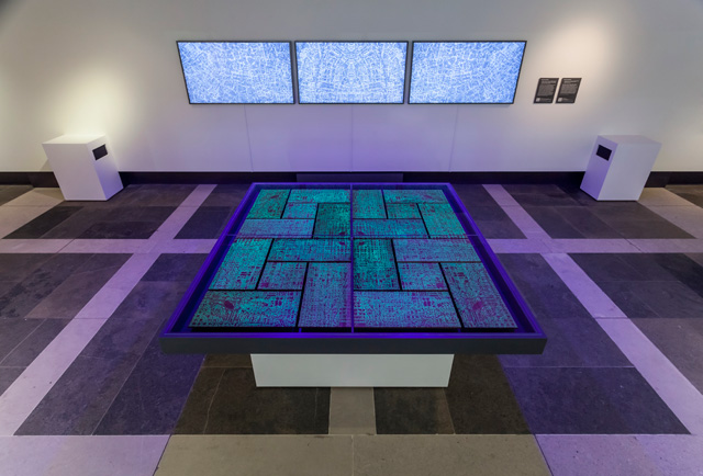 Installation view of Michael Takeo Magruder, Imaginery Cities at the British Library. Photo: David Steele © Michael Takeo Magruder.