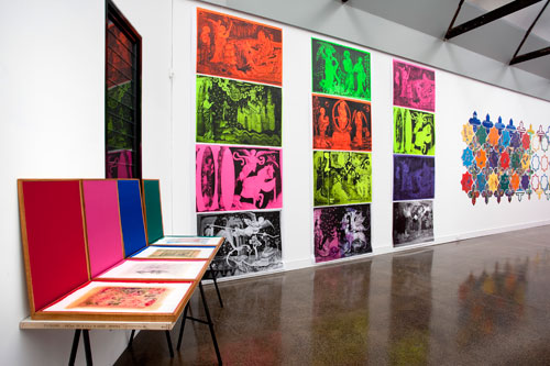 Irene Barberis. Installation view: Apocalypse/Revelation: Re Looking (Feminale; the edge of logic, intersecting luminosities), 2012, Langford120, Melbourne, Australia.
From left to right:
Fresh Leaves: boxes of gatherings (excerpts from apocalyptic literature and the illuminated manuscripts), 1196-2012. Handmade wooden boxes containing 250 sprayed, painted, printed, collaged and embroidered acid free pages. Each box 60 x 40 cm.
Apocalypse Posters: interventions into the 'Angers Tapestry', 2010. Fluorescent oil based printing ink, printed on BFK Poster paper, 1 of 5, 100 x 150 cm.
Star 2000 - Online (Revelation, Chapters 11 – 14), 1998-2000. Acrylic polymer, oil paint, on laser-cut wood with plastic texts, 240 x 600 cm (each component 58 x 58 cm).
Photograph: Mark Ashkanasy.