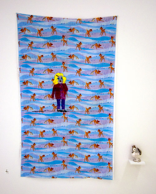 Jenny Watson. Toddler with lolly pop 2009. Acrylic on rabbit skin glue primed Bambi print cotton + vintage American ceramic rooster, 190 cm x 110 cm. Courtesy Transit Gallery, Mechelen, Belgium.