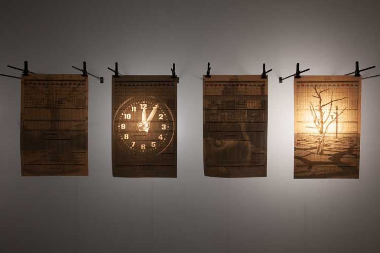 Peter Kennard and Nigel Brown. Double Exposure, 2023. Financial Times newspaper, pigment prints, metal, LED lights and Raspberry Pi. Image courtesy of the artist.