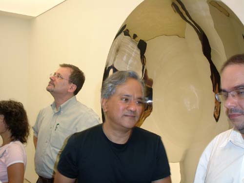 Anish Kapoor stops before his Double mirror, 1998. Double Mirror, 1998, stainless steel, two parts, 200 x 200 cm (each)