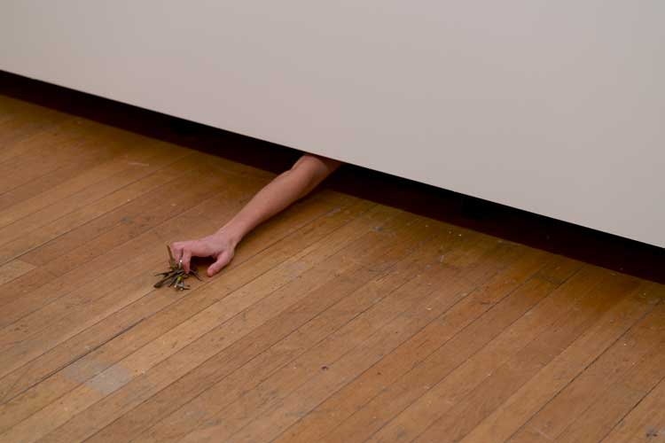 Laura Lima, Ascenseur, 2008/2026. Person’s arm, set of keys, wall. Installation view, Laura Lima: The Drawing Drawing, Institute of Contemporary Arts, London. Photo: Anne Tetzlaff.