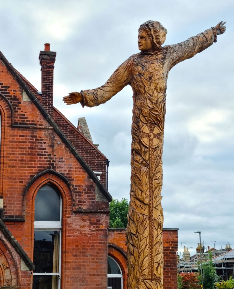 Susanna Wesley by Simon O’Rourke, 2022. Red cedar wood. East Finchley Methodist Church. Photo: Juliet Rix.