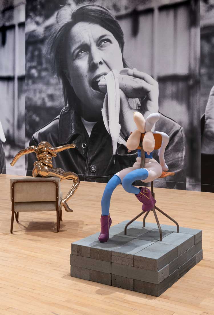 Sarah Lucas, Happy Gas, installation view, Tate Britain, 2023. Zen Lovesong, 2023, Goddess, 2022, and Eating a Banana, 1990. © Sarah Lucas. Photo © Tate (Lucy Green).