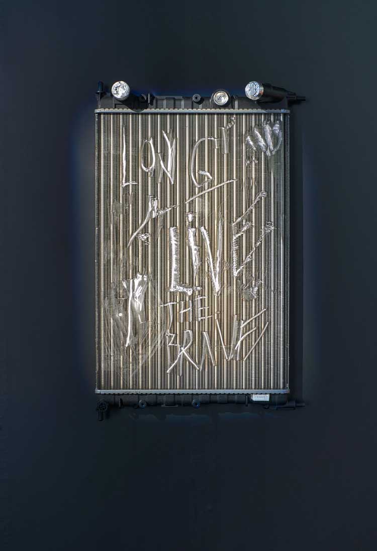 La Horde, Radiator (Long Live the Brave), 2023. Car radiator, 64 x 40 x 10 cm. Installation view, (LA)HORDE, JSF Berlin. Photo: Alwin Lay.