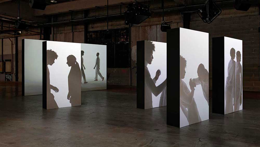 Manifesto of Fragility, Biennale de Lyon 2022. Installation view. Right: Ugo Schiavi, Grafted Memory System, 2022. Courtesy of the artist. With the support of Jacquet Métals Service, Alabama. With the kind collaboration of Laboratory of Geology, University Lyon 1, Musée des Confluences, Lugdunum - Musée et théâtres romains. Upstairs: Lucile Boiron, Mater, 2022. UV photographic prints on glass and plexiglass, glass and silver prints. With the support of Galerie Hors Cadre, Modds, Pro Image Service, Diamantino Labo Photo. Commissioned for the 16th edition of the Biennale de Lyon, Musée Guimet. © Blandine Soulage.