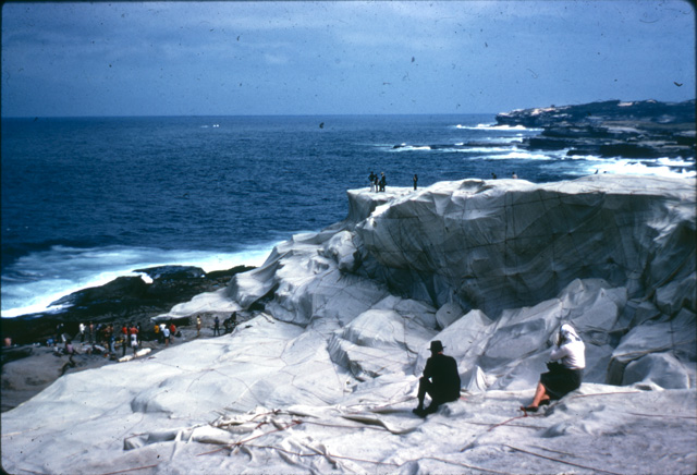 A photo of Kaldor Public Art Project 1: Christo and Jeanne-Claude’s Wrapped Coast – One Million Square Feet taken by art education lecturer Ellen Waugh in 1969. Ellen used her photographs as slides for teaching. These slides were scanned and new colour photographs of the legendary project were discovered last year.