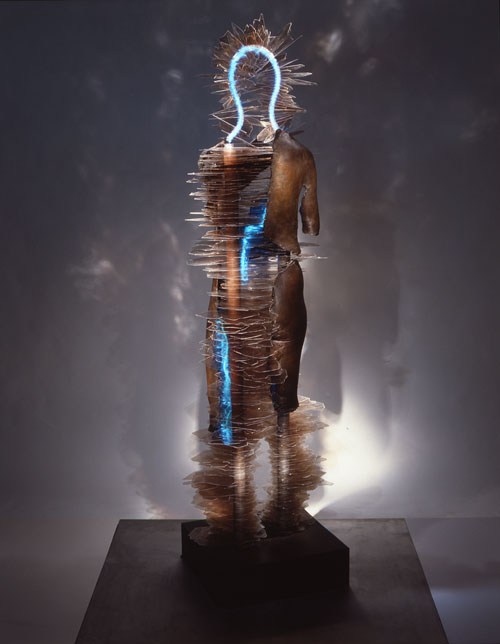 Liliane Lijn. My Body My Self. Patinated bronze, ruby mica, argon, stainless steel, 202 x 60 x 52 cm (6' 7" x 23.5" x 20.5"). Photograph: Liliane Lijn.