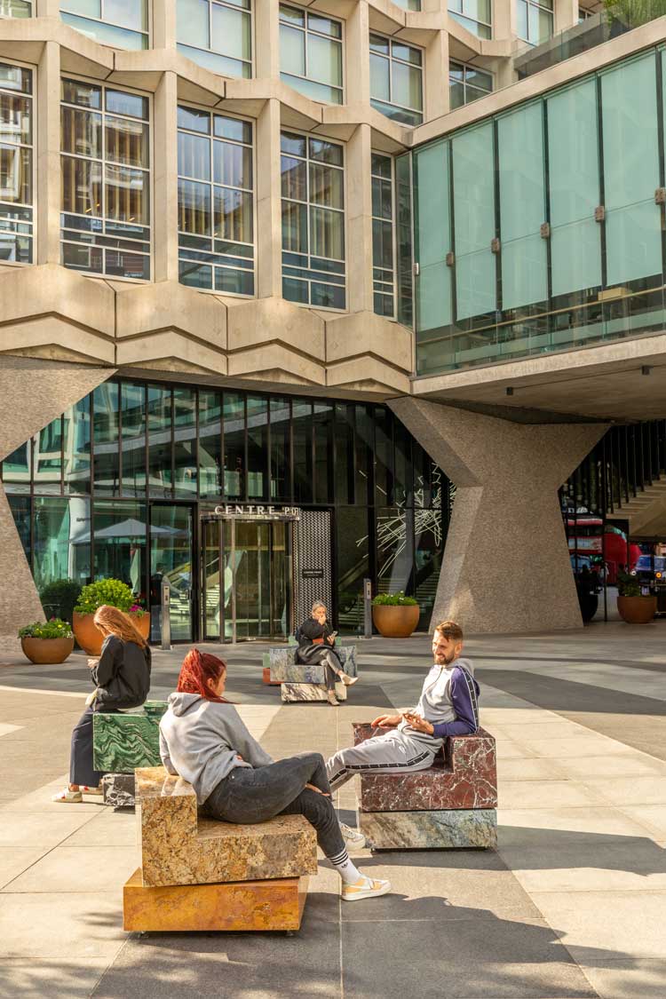 Sabine Marcelis, Swivel, 2022. Rotating stone chairs, installation view, Centre Point, St Giles Square, London. Photo: Ed Reeves.
